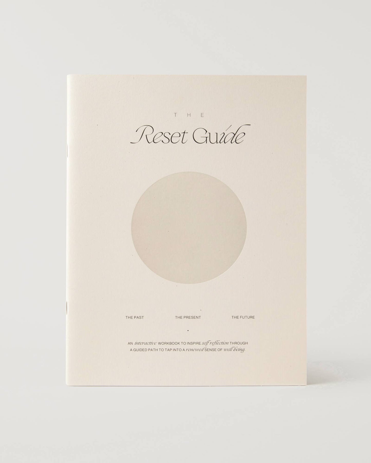 Journal titled 'The Reset Guide' with a circular design on a white background