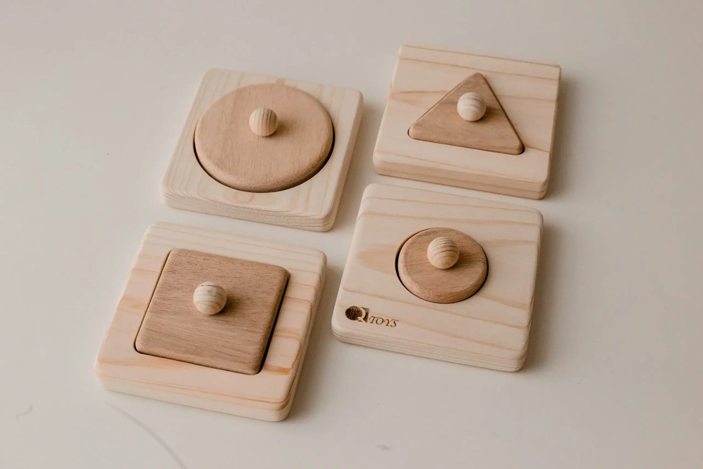 Set of wooden puzzles with geometric shapes.