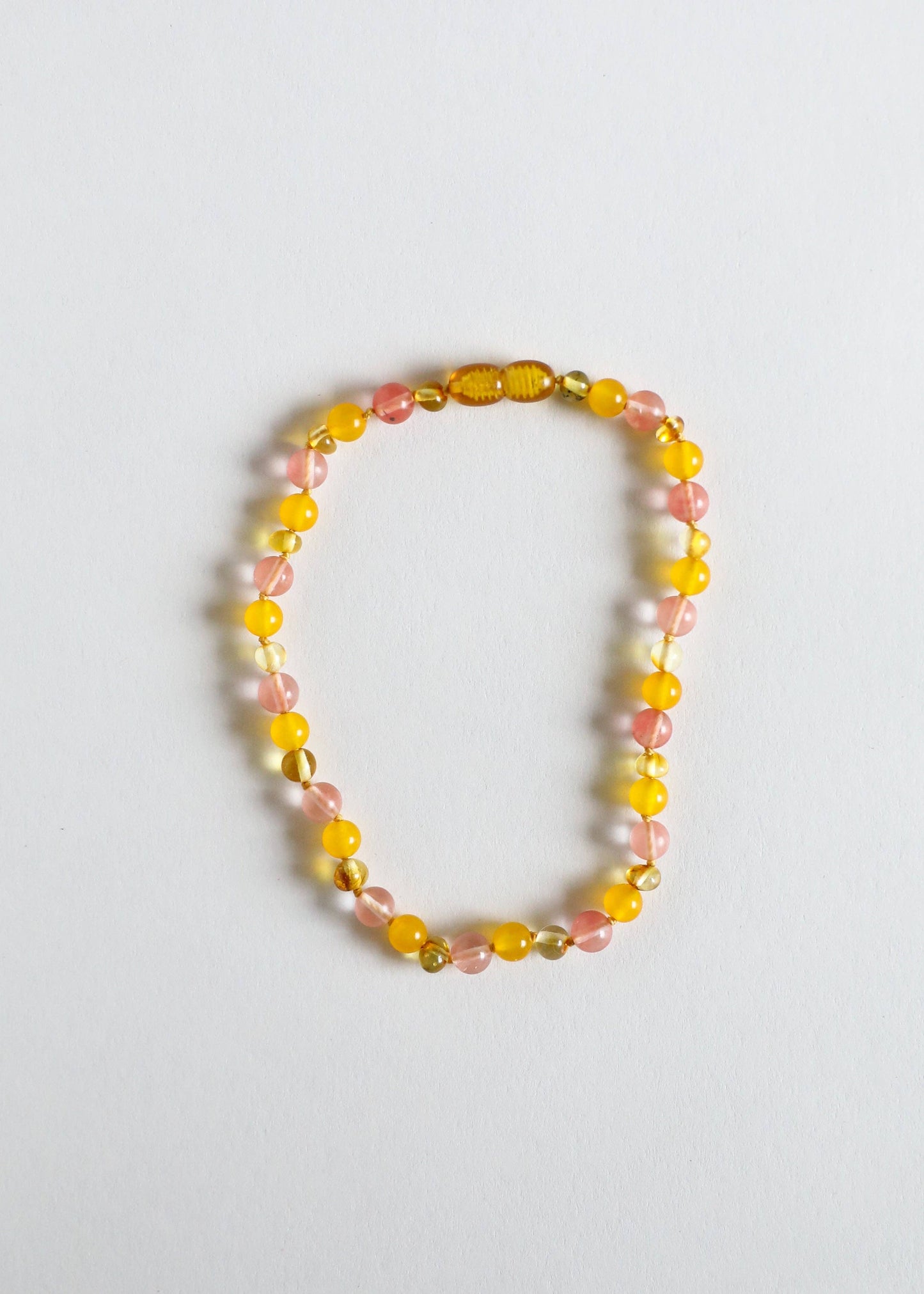Lightweight Polished Baltic amber and rose quartz necklace.
