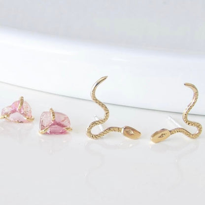 10K Gold snake-shaped earrings Made with recycled metals.