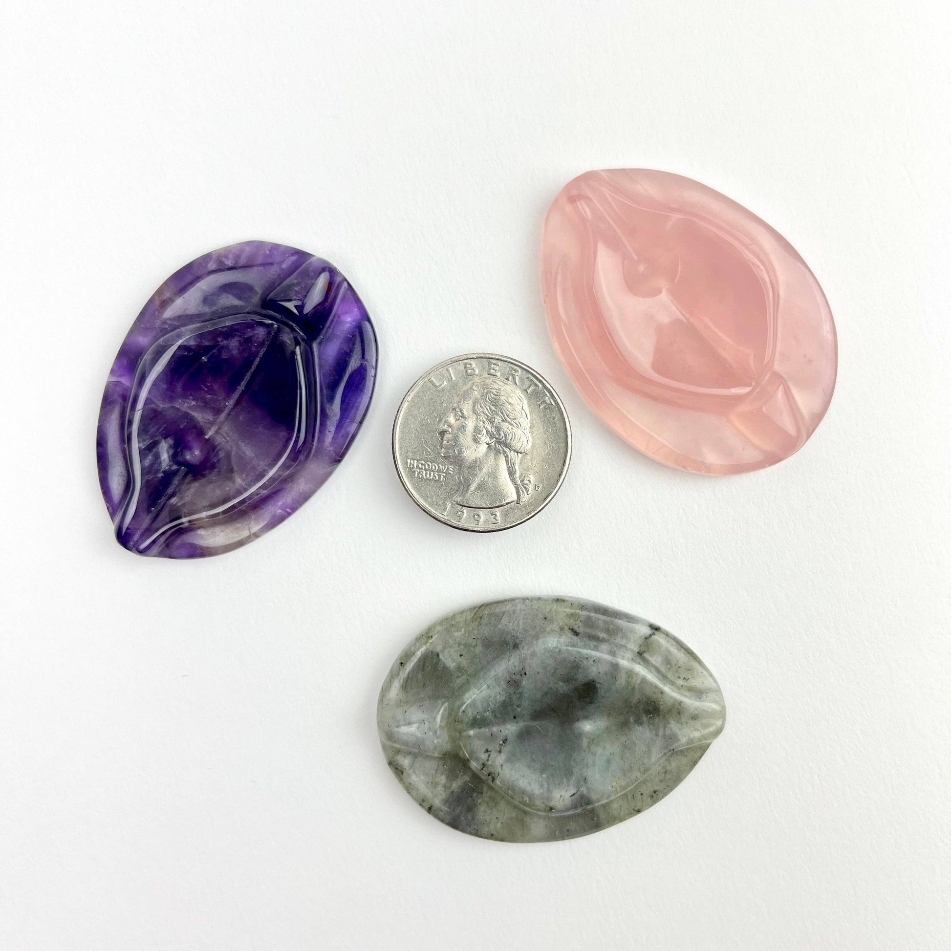 A amethyst vulva worry stone.