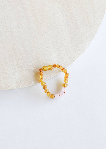 A honey amber with rose quartz baby bracelet.