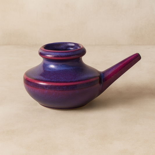 Adult size purple ceramic neti pot.