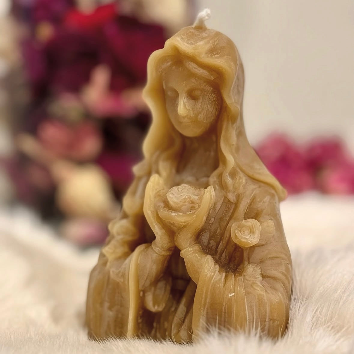Blooming mother beeswax candle.