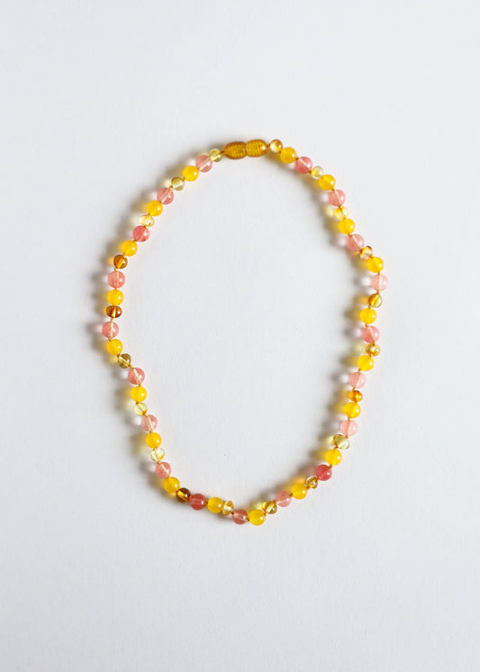Polished Baltic amber child necklace.