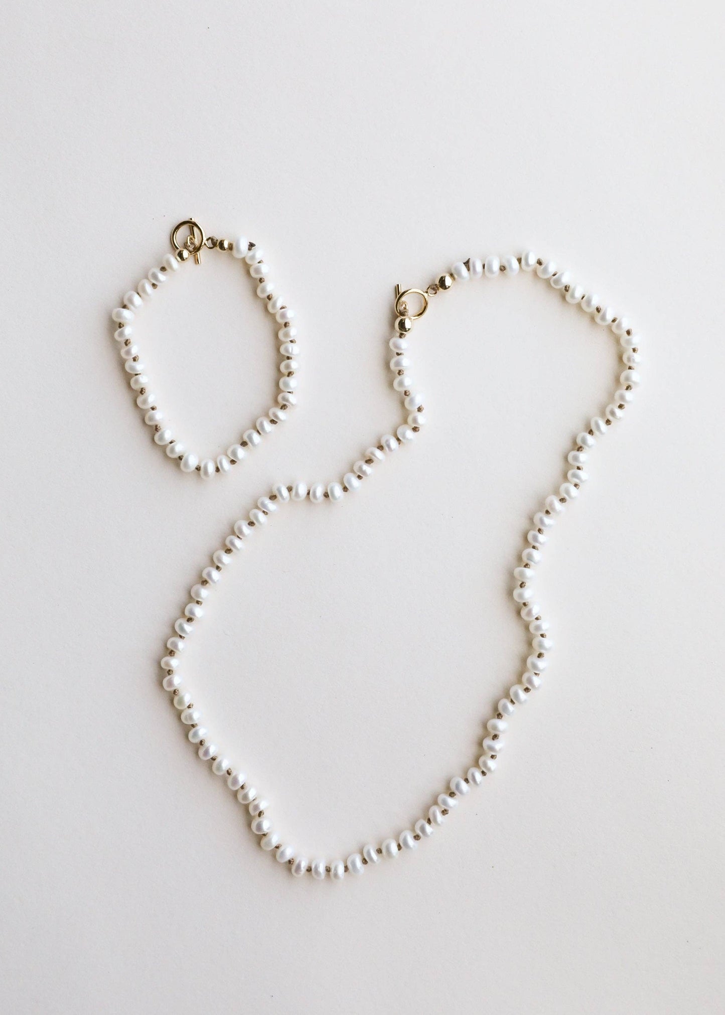 A freshwater pearl necklace with a 14K gold clasp.