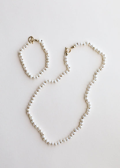 A freshwater pearl necklace with a 14K gold clasp.
