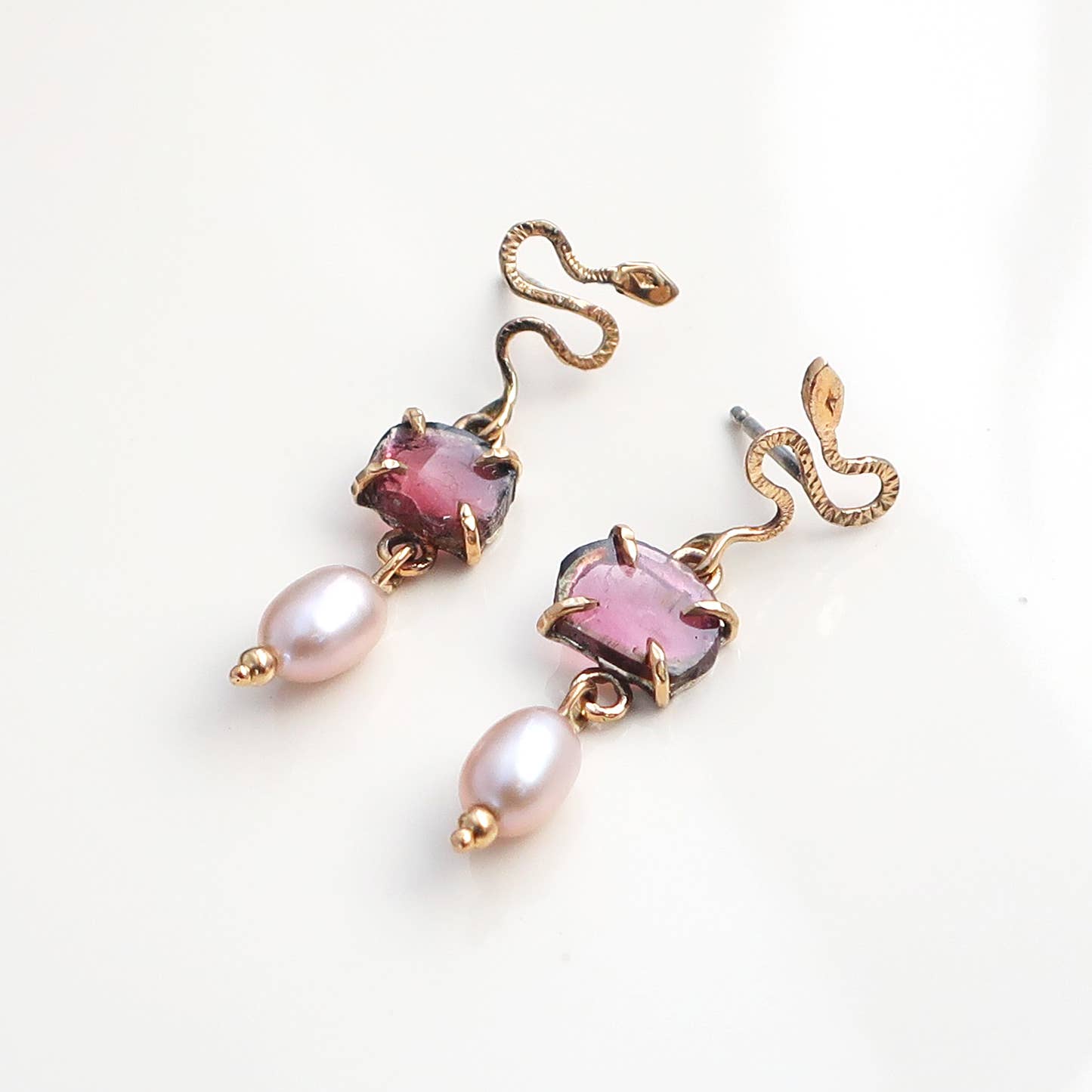Made with 10K gold and pink Tourmaline with natural pearls dangling earrings.