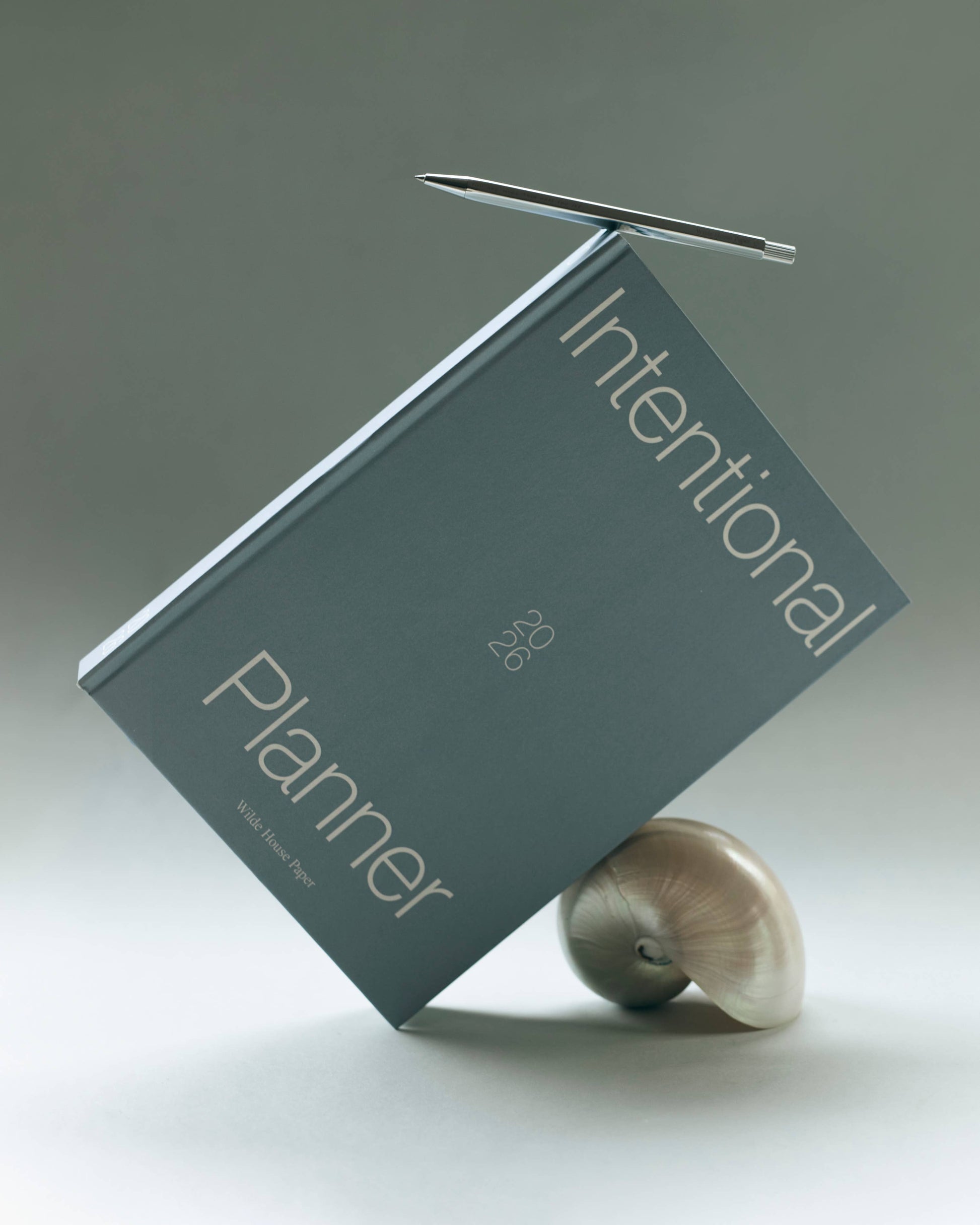 Blue planner with 'Intentional Planner 2026'.