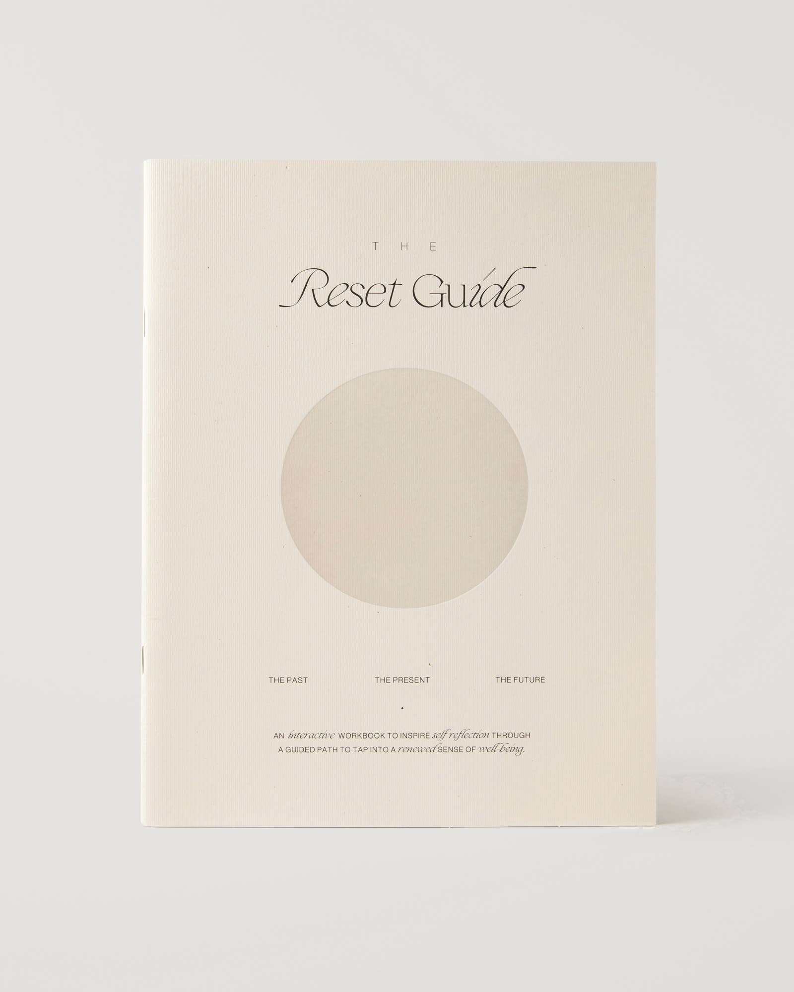 Journal titled 'The Reset Guide' with a circular design on a white background