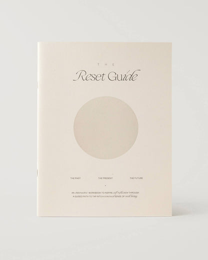 Journal titled 'The Reset Guide' with a circular design on a white background