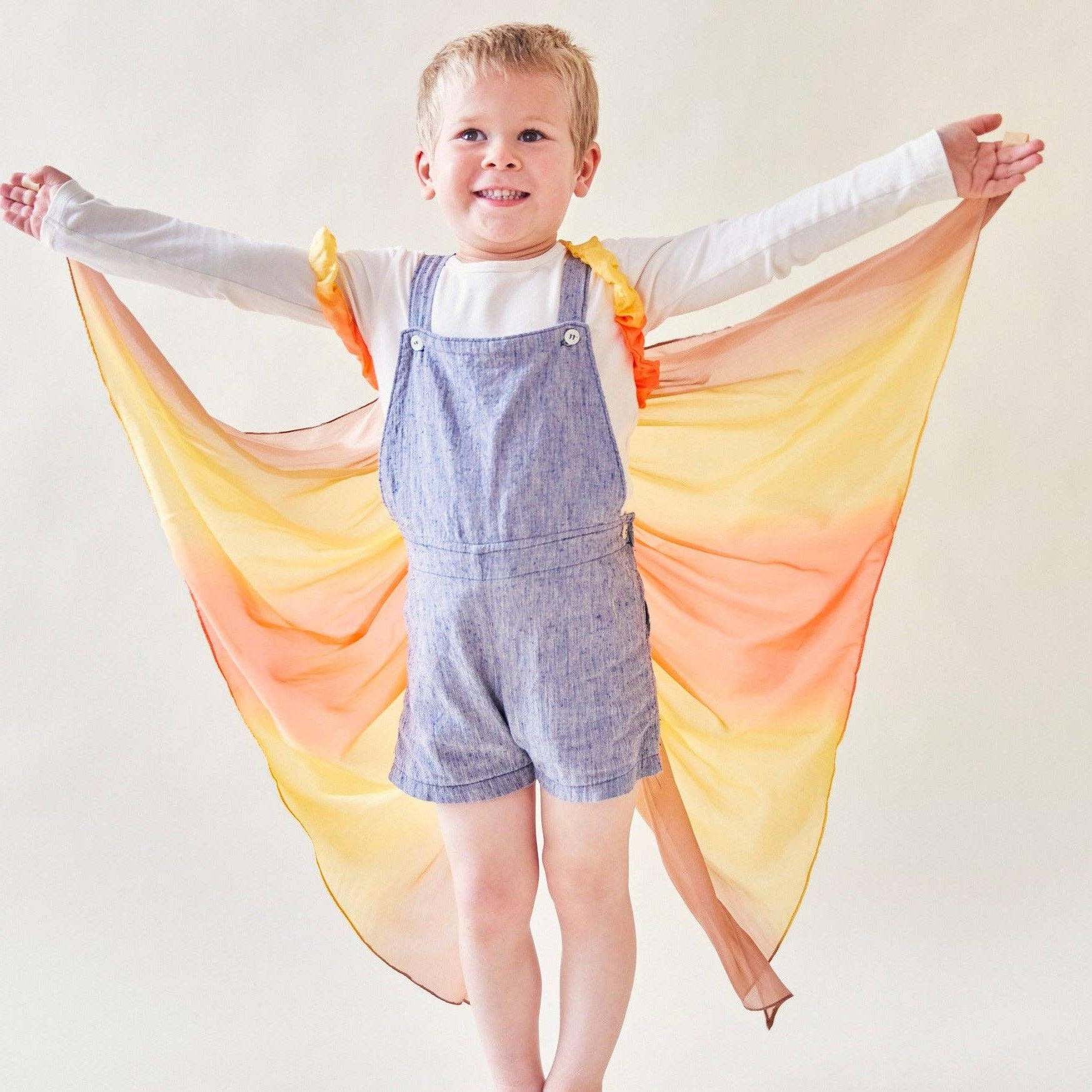 All-natural desert color play silk wings.