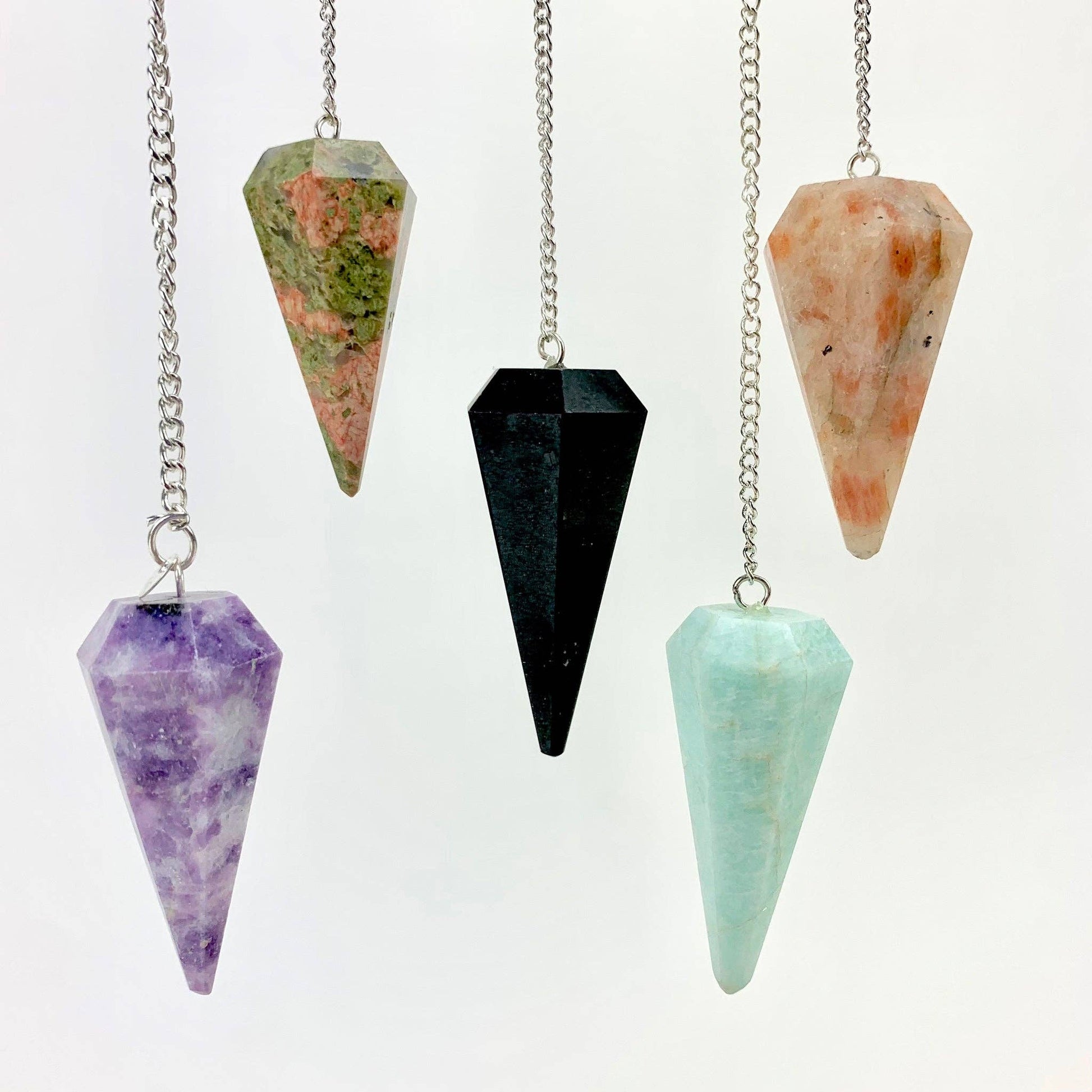 Polished ritual crystal pendulum.