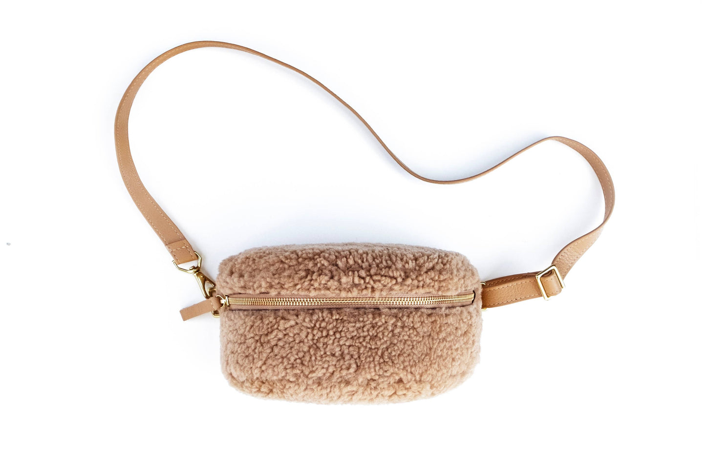 A brown sheepskin bum bag.