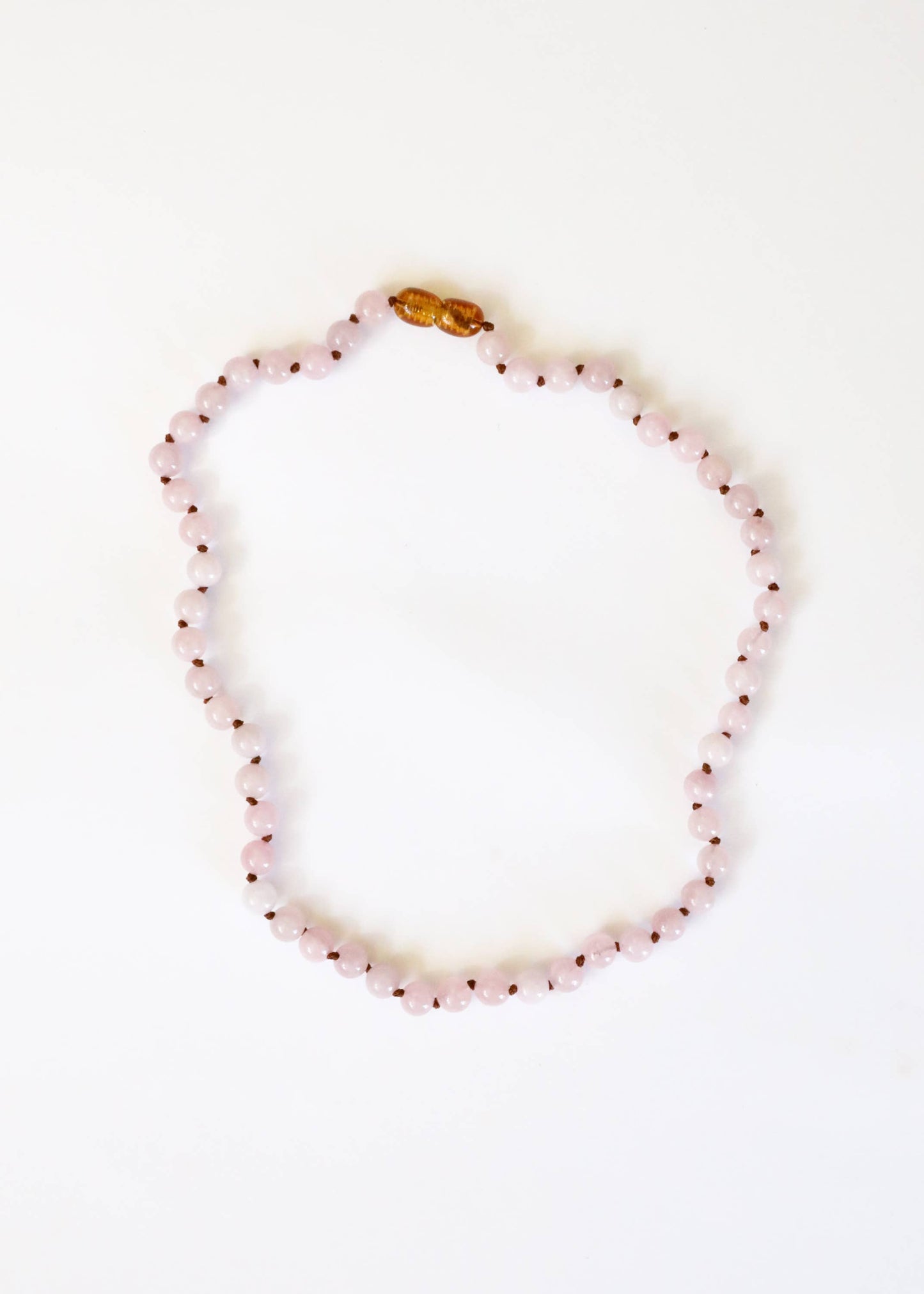 Child pure gemstone rose quartz necklace.