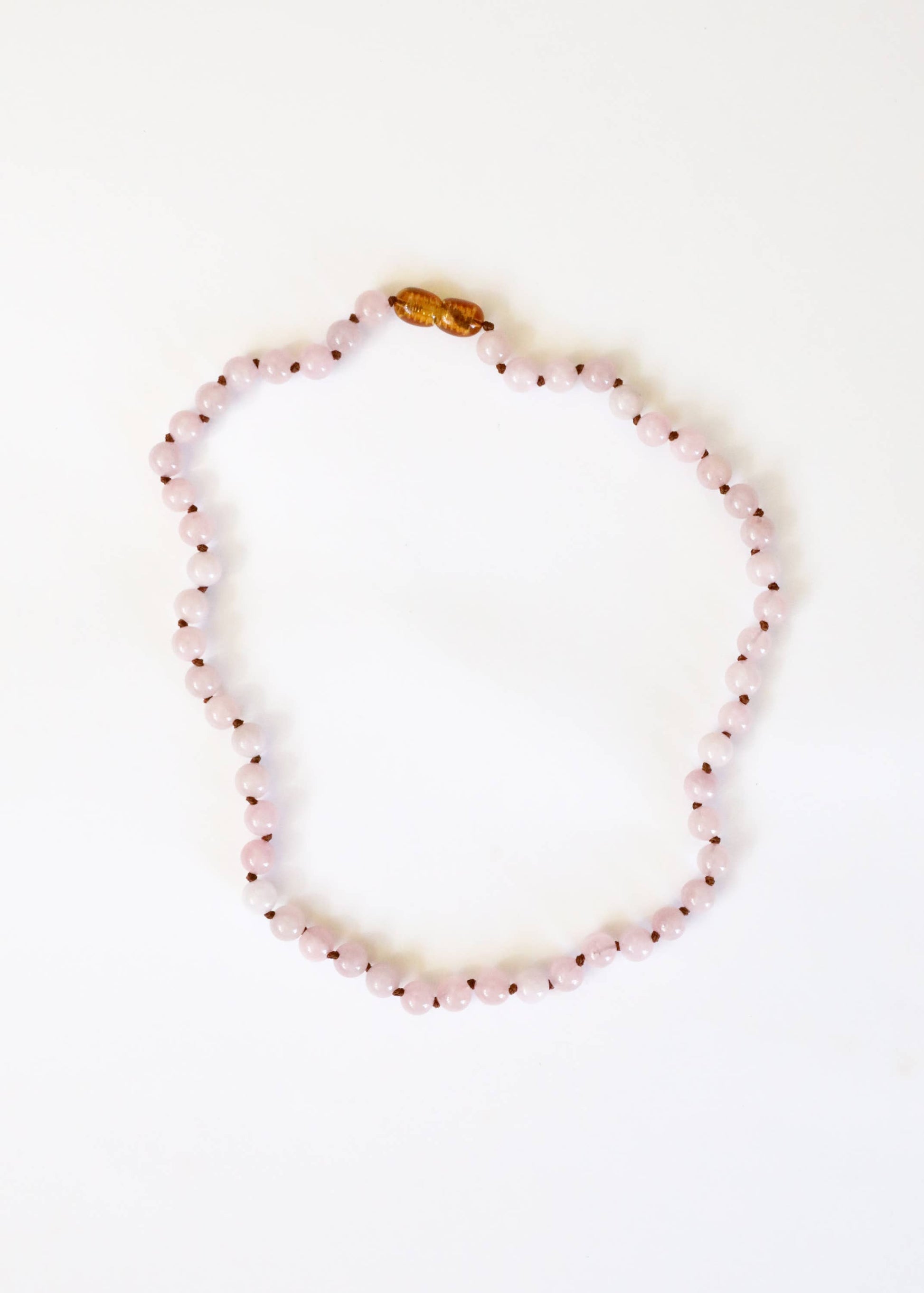 Child pure gemstone rose quartz necklace.
