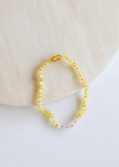 Raw Baltic amber and rose quartz necklace for babies.
