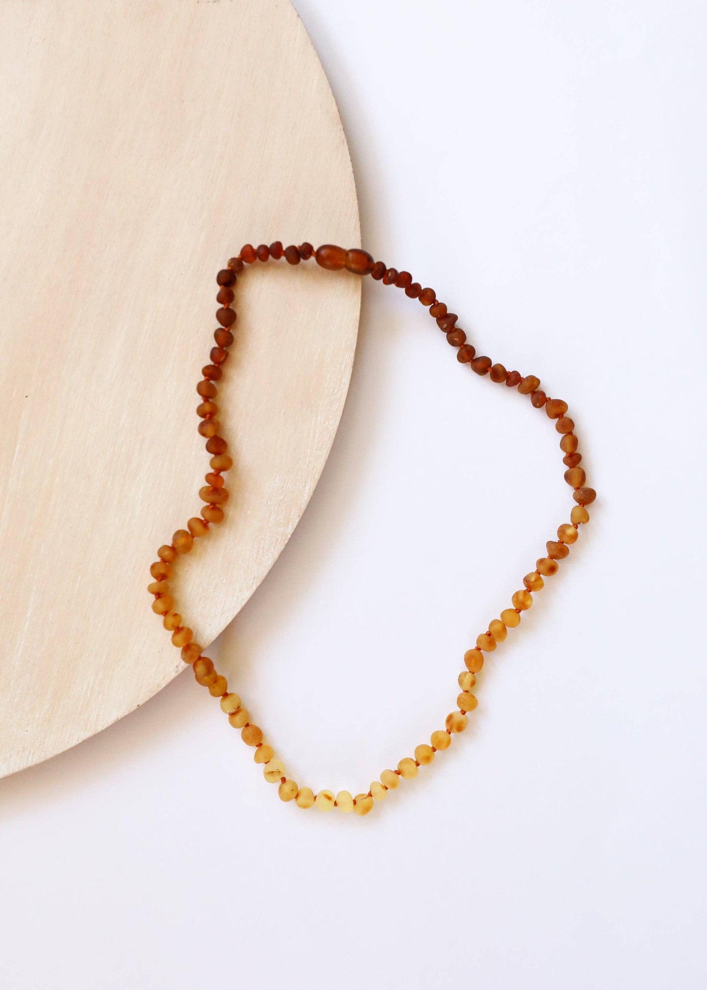 A raw amber teething necklace for babies.  