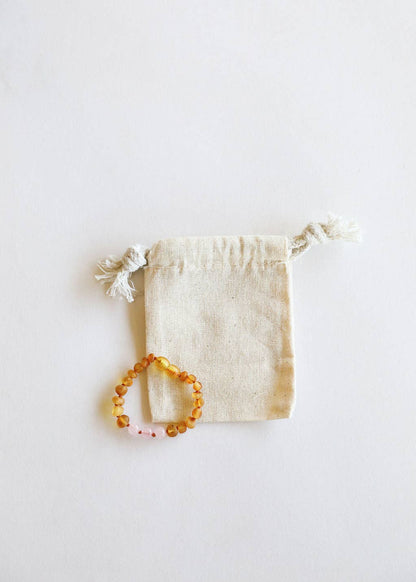 Rose quartz and honey amber beaded baby bracelet. 
