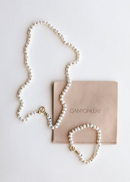 Pearl necklace with a 14k Gold clasp.