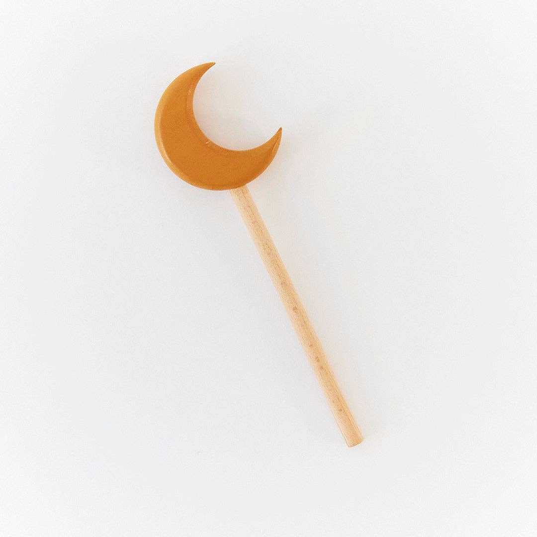 Wooden crescent moon wand.
