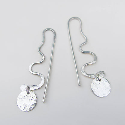 Lightweight silver dangling snack earrings.
