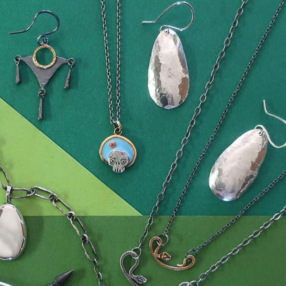 Timeless solid sterling silver hammered organic looking drop earrings.