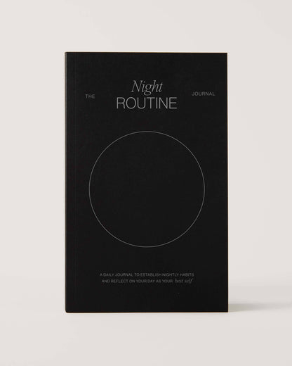 Black notebook titled 'The Night Routine Journal' 