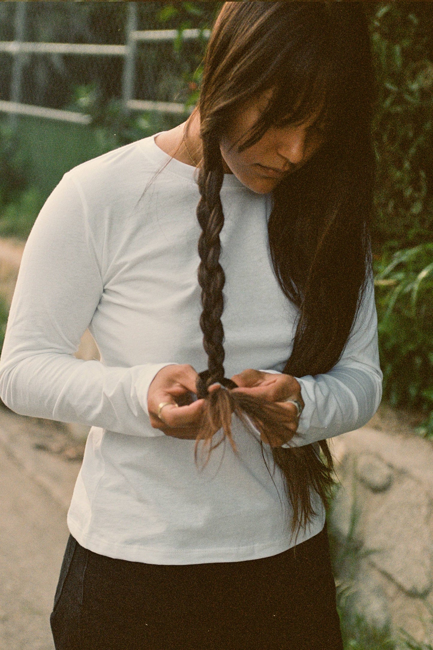 Woman wear white long sleeve tee shirt.