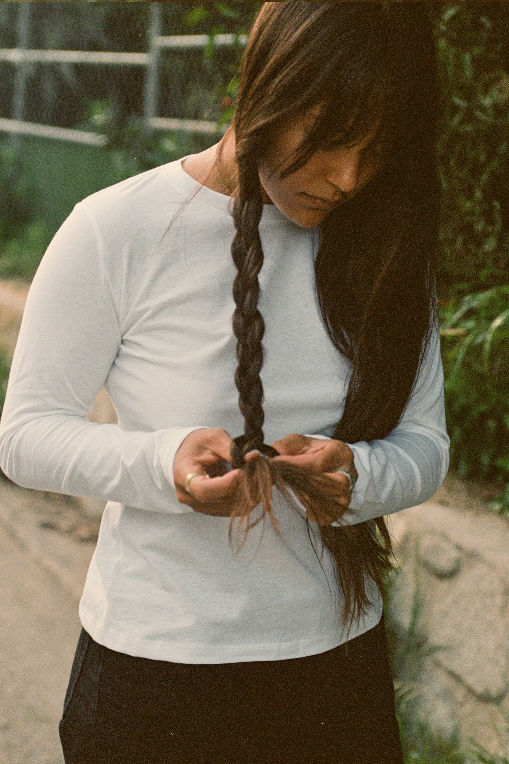 Woman wear white long sleeve tee shirt.