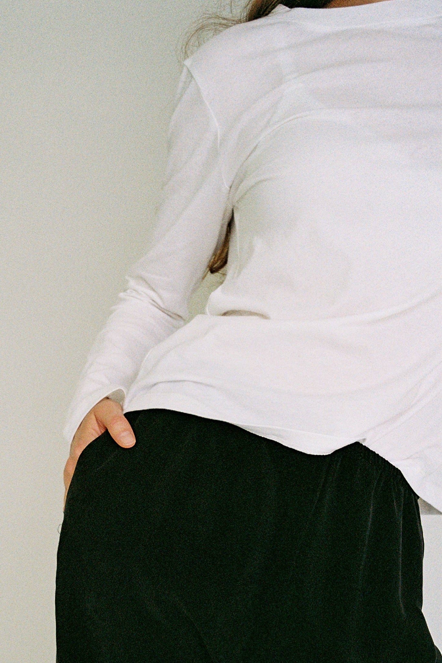  A white long-sleeve top.